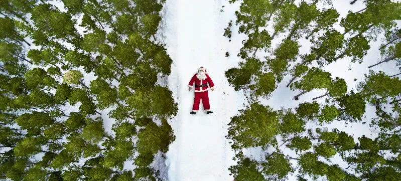 Santa laying in the snow